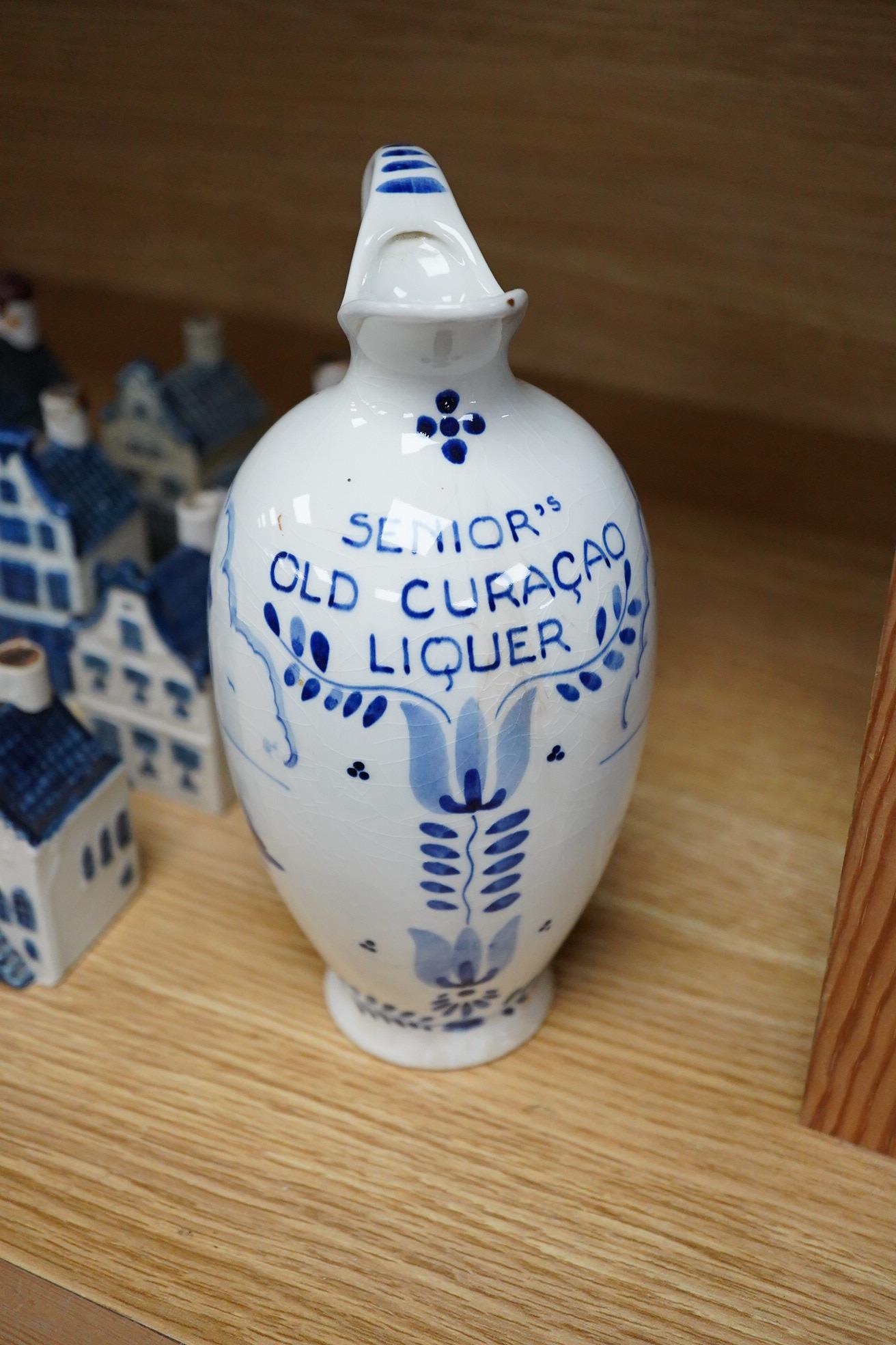 A collection of twenty seven KLM Delft blue miniature houses presented to Business class passengers together with a Delft jug - 20.5cm high